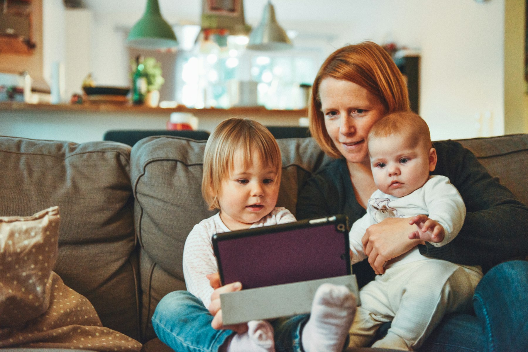 A parent and child with a tablet